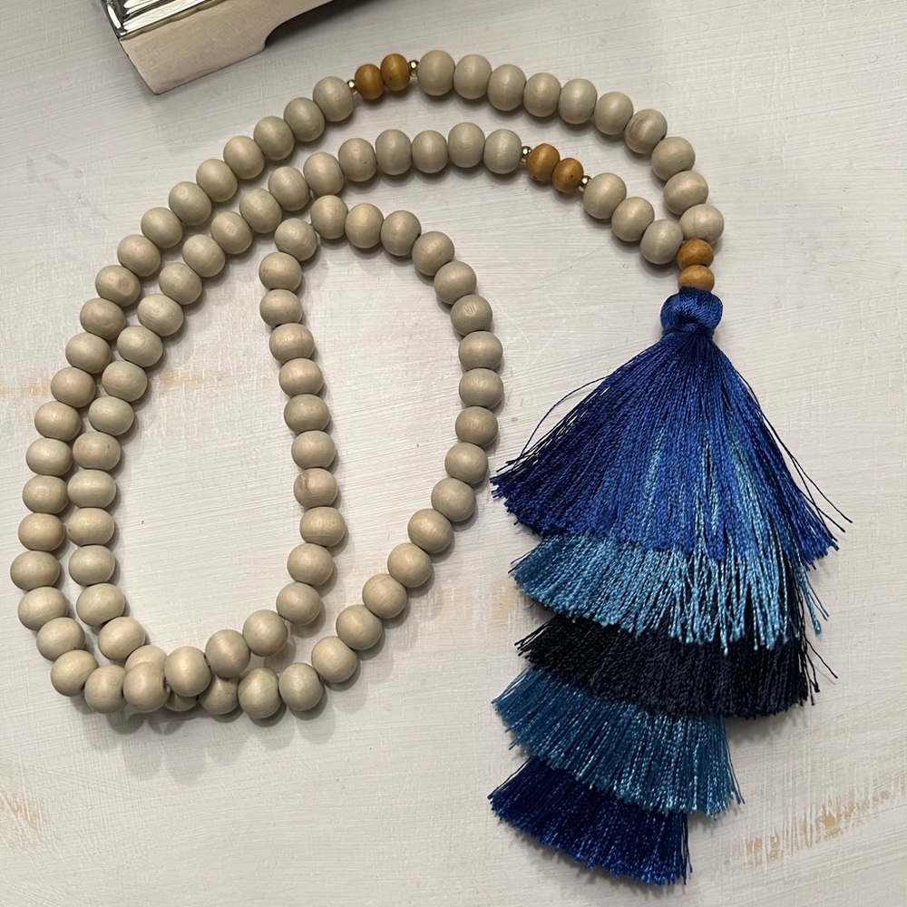 Bead and tassel blue necklace.